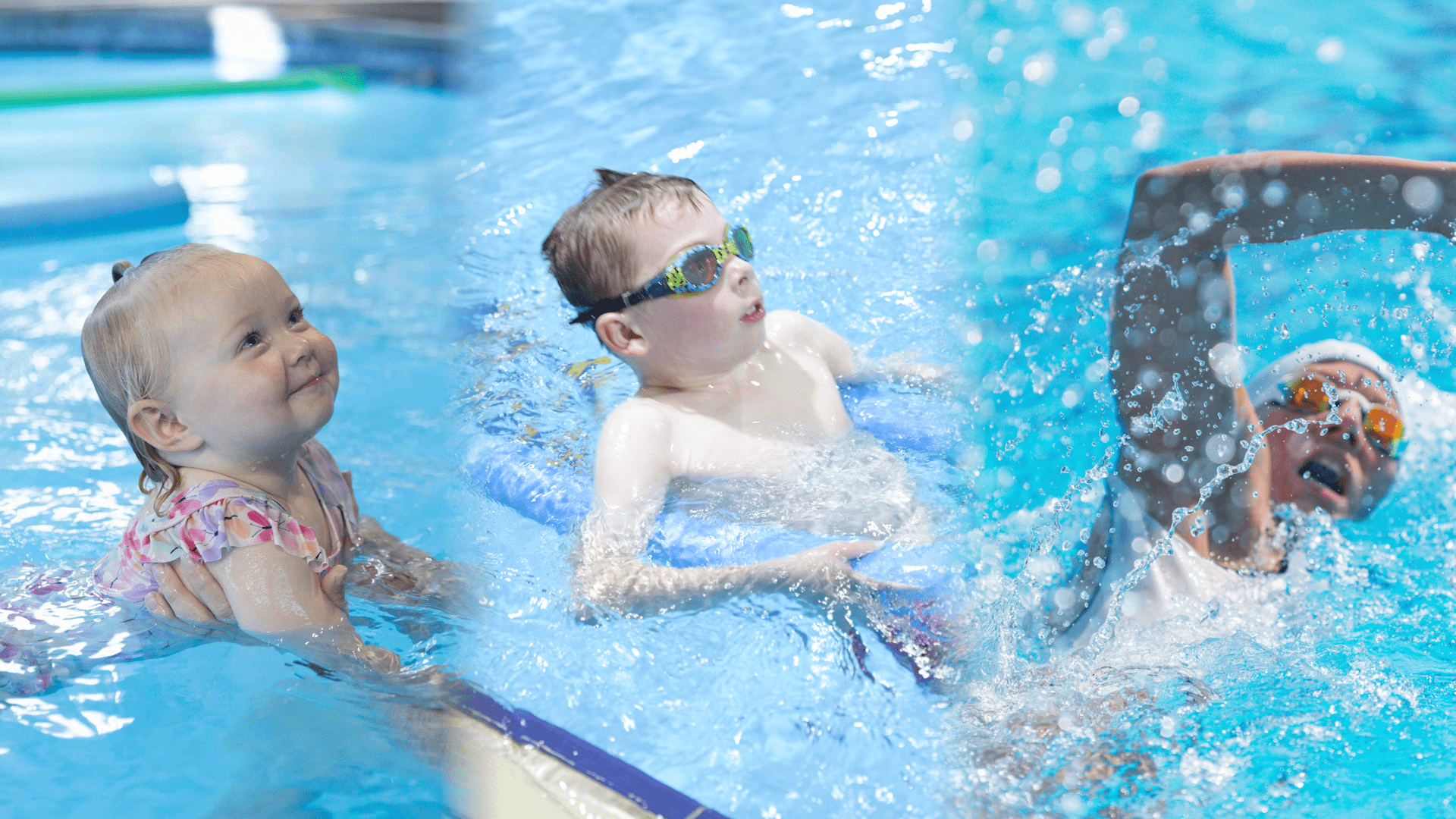 Collage of three swimmers at Peninsula Swim School: a smiling toddler held by an instructor, a young child practising back floating with goggles and a kickboard, and an adult swimmer in goggles and cap performing a freestyle stroke in the pool at Peninsula Swim School located within Core24 Health Clubs in Frankston, Somerville, and Mornington.